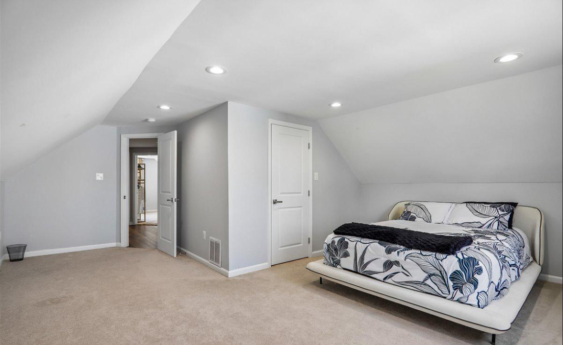Master suite with vaulted ceiling