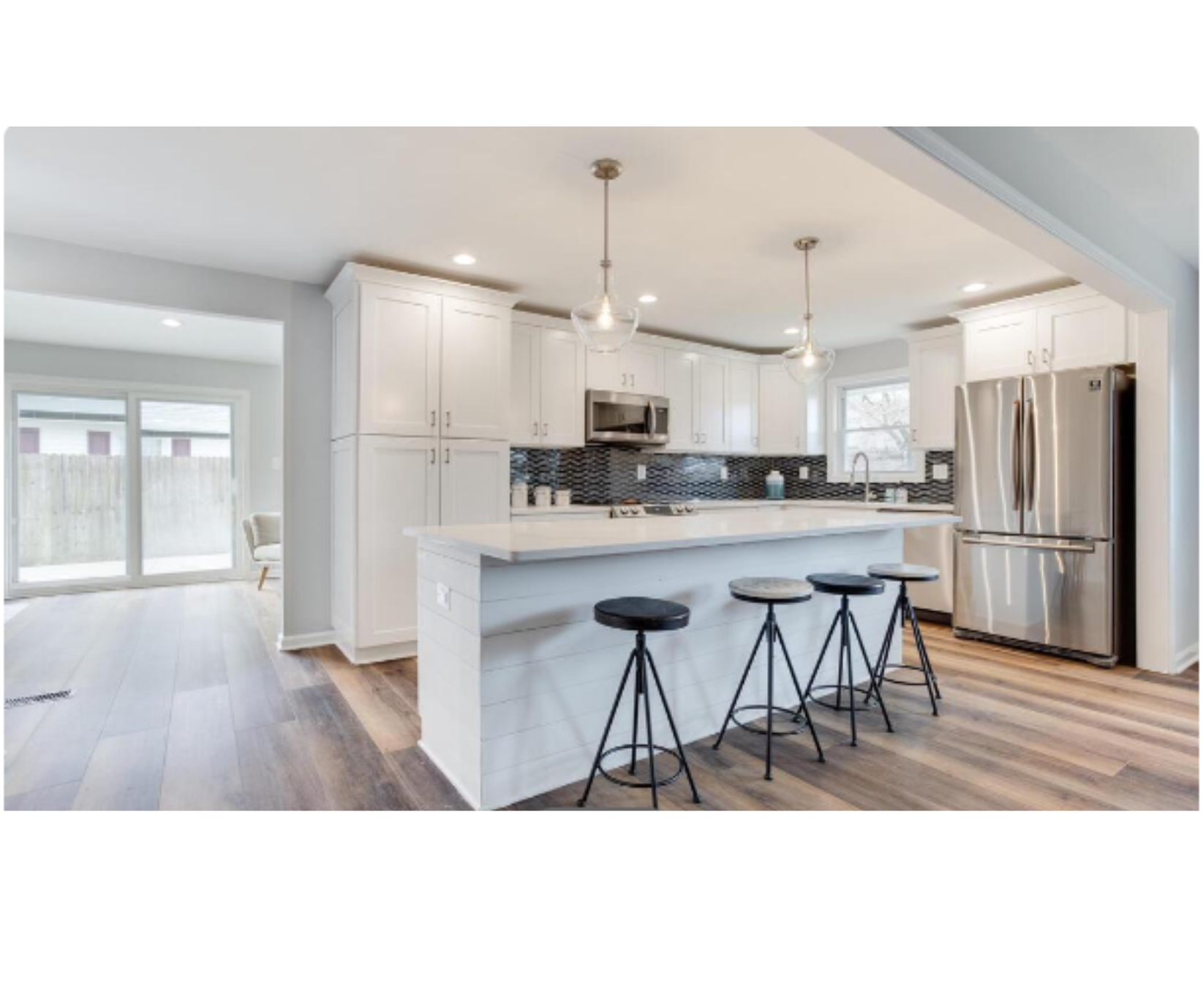 Modern open kitchen with island and stools