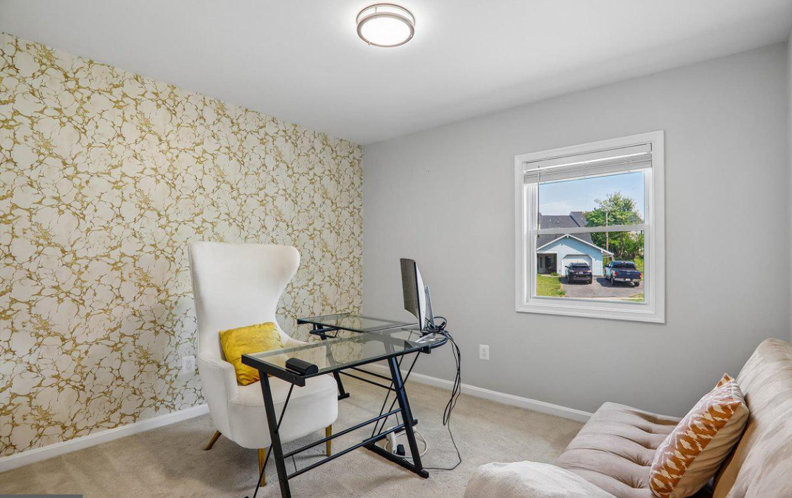 Dedicated home office with desk and seating